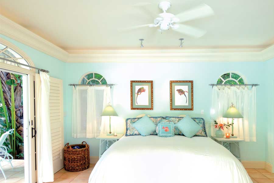 The guest room's soothing colors mimic the Caribbean waters; the room has a private patio, perfect for napping.